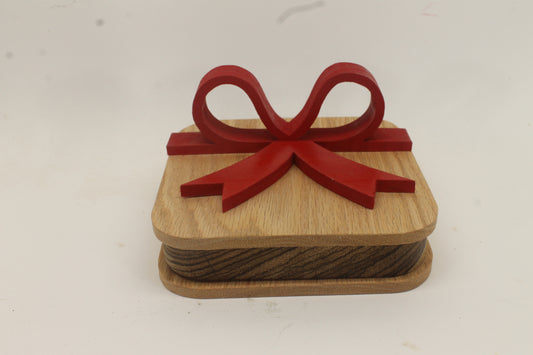 Wooden gift box with red wooden bow