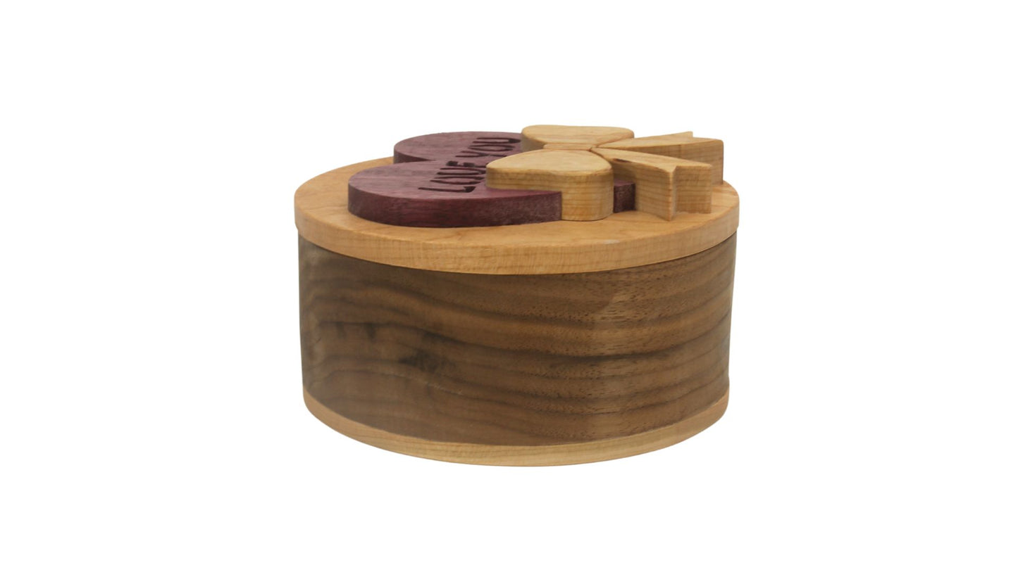 Round storage box with heart and bow on top