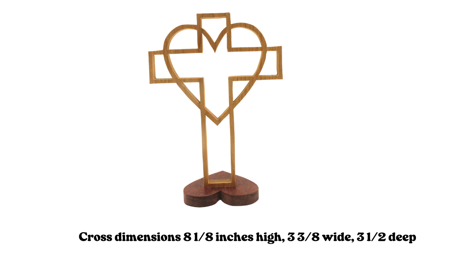Cross surrounded by a heart on a heart-shaped base