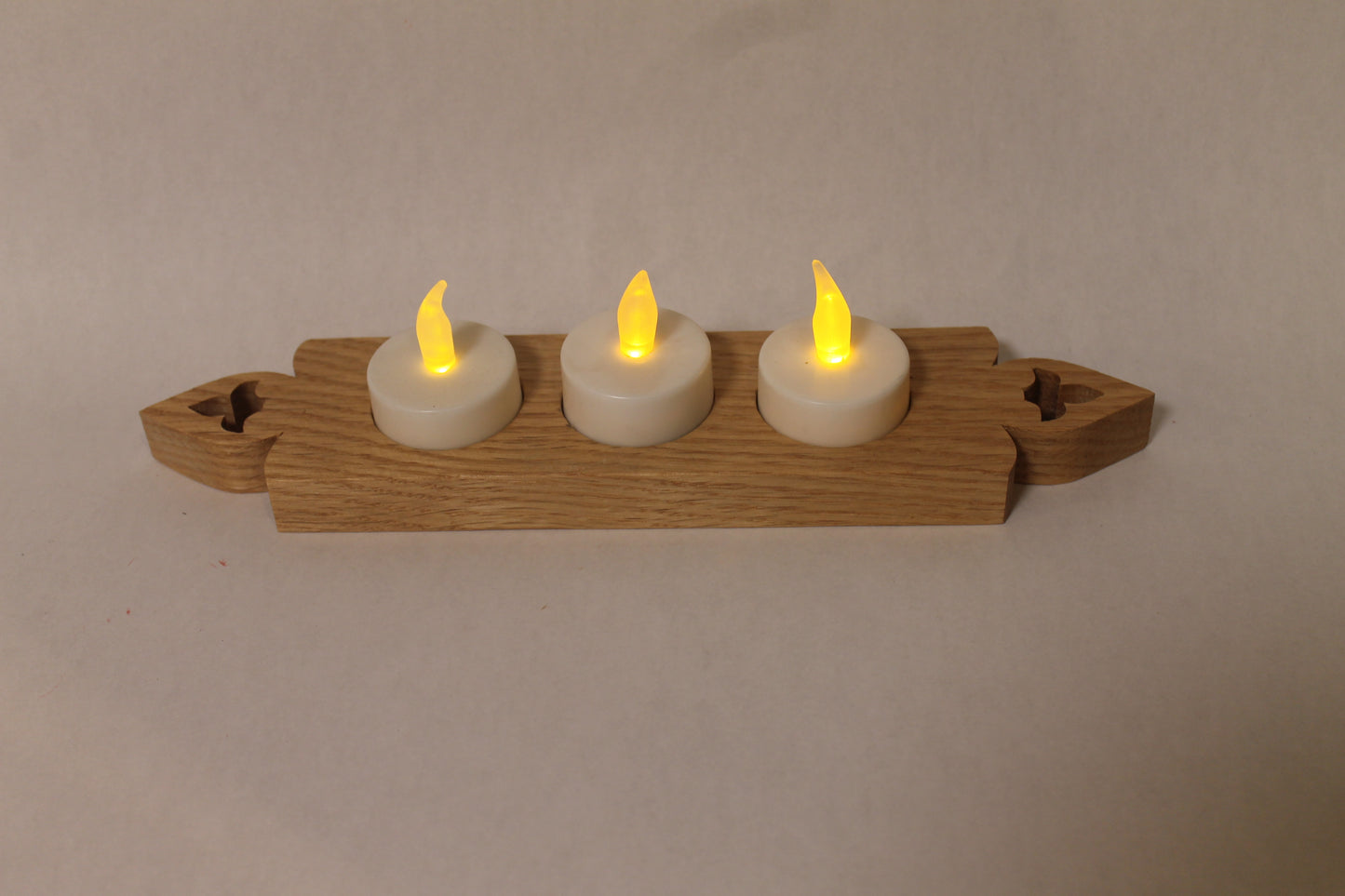 Candle holder with three electric candles