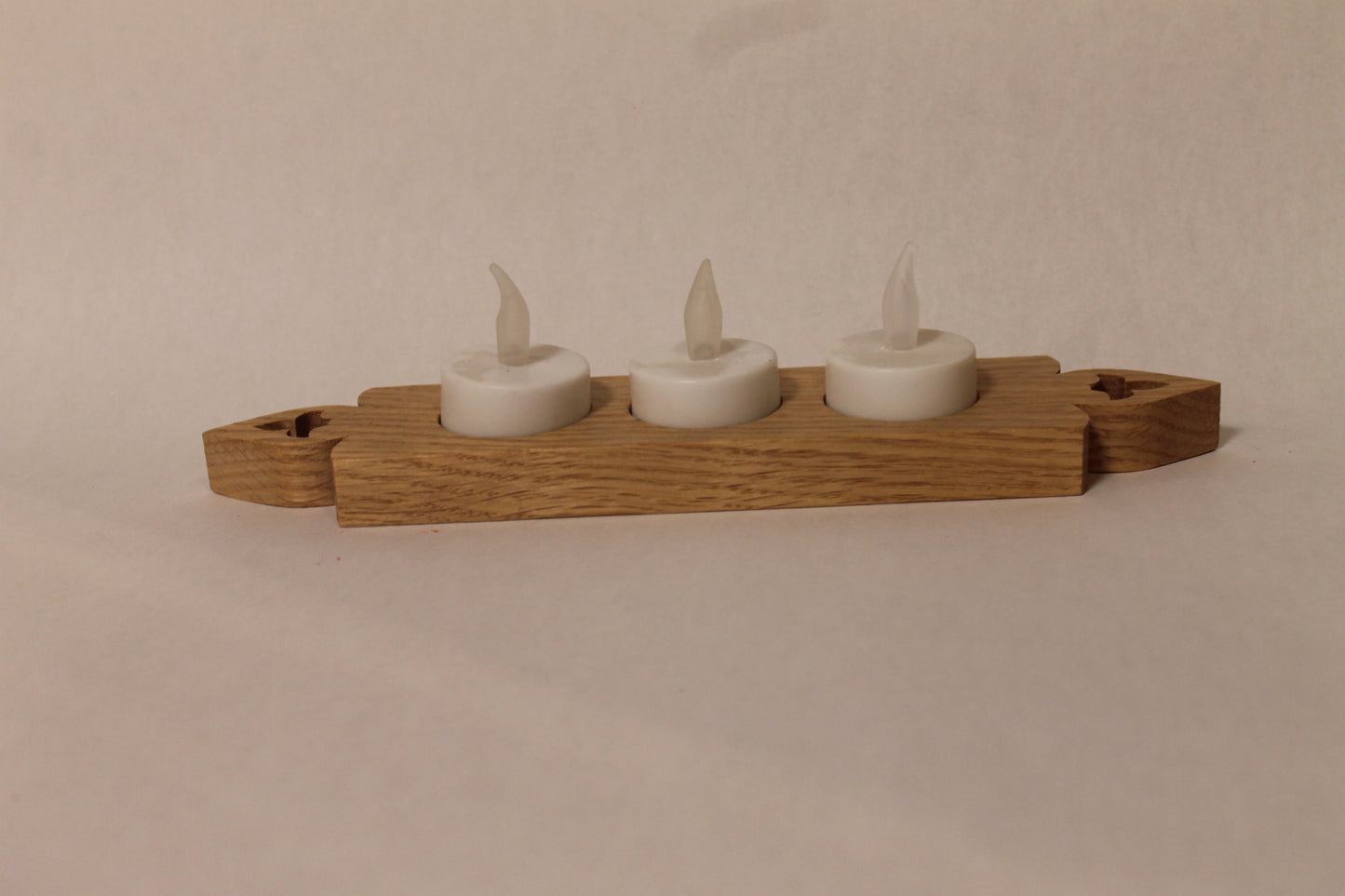 Candle holder with three electric candles