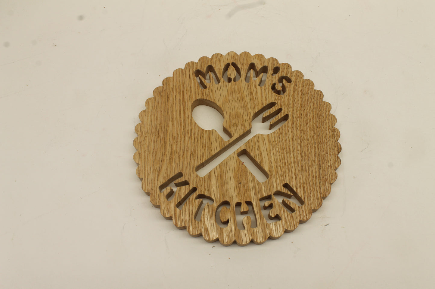 Mom's Kitchen trivet handcrafted from red oak