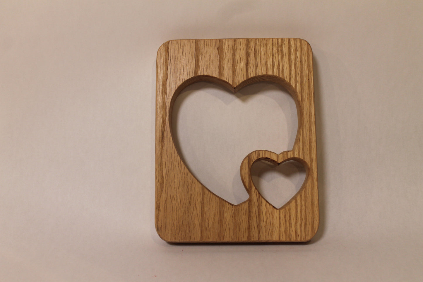 Double heart wall hanging decoration handcrafted from oak