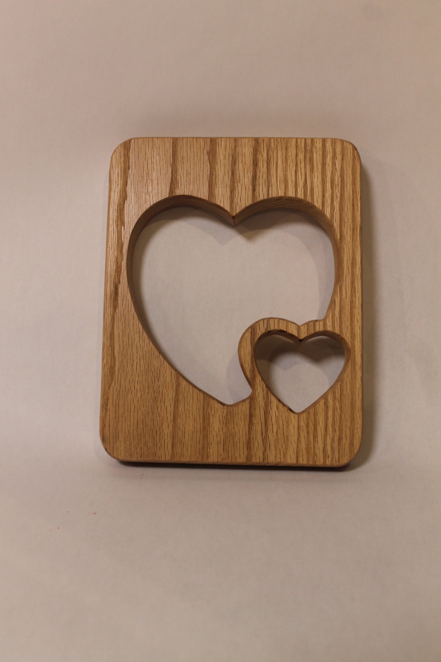 Double heart wall hanging decoration handcrafted from oak