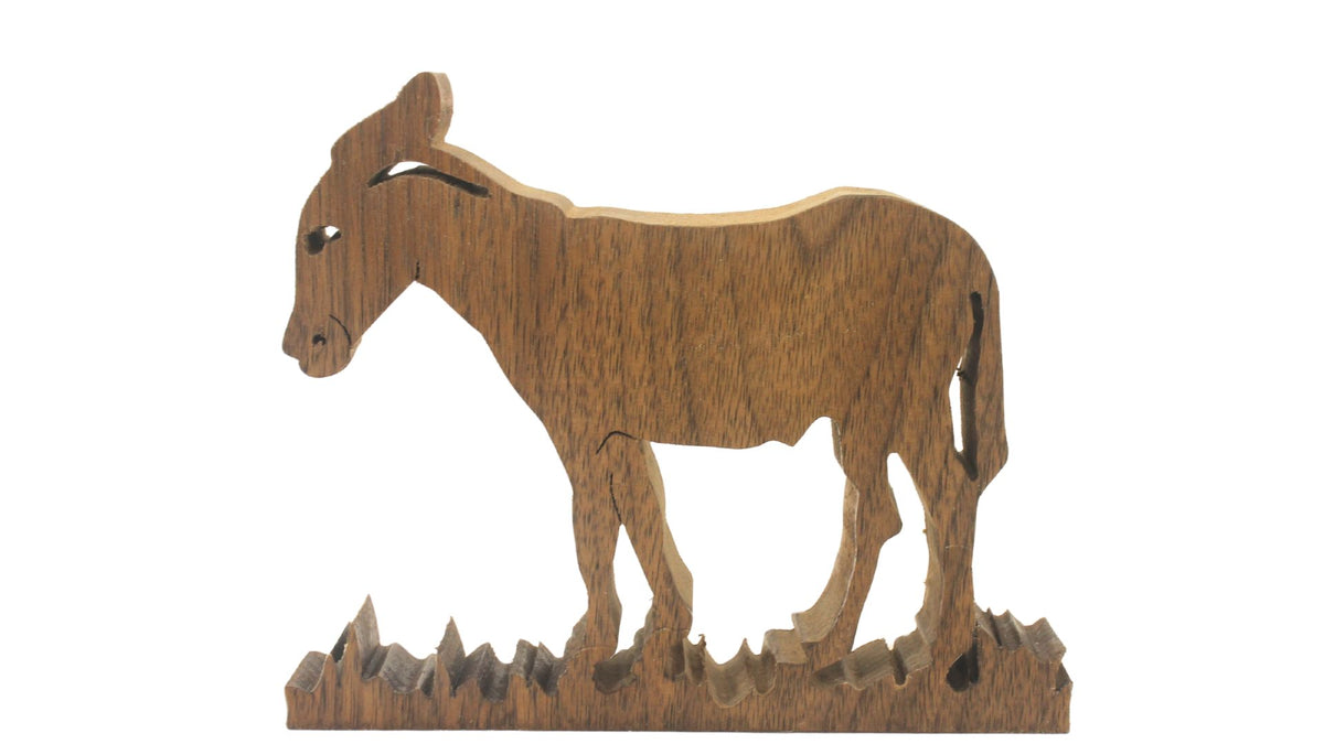 Nativity set, freestanding figures and animals. Mary, Joseph, baby Jesus, shepherd, kings, donkey, cow, camel. Hand cut from hardwoods