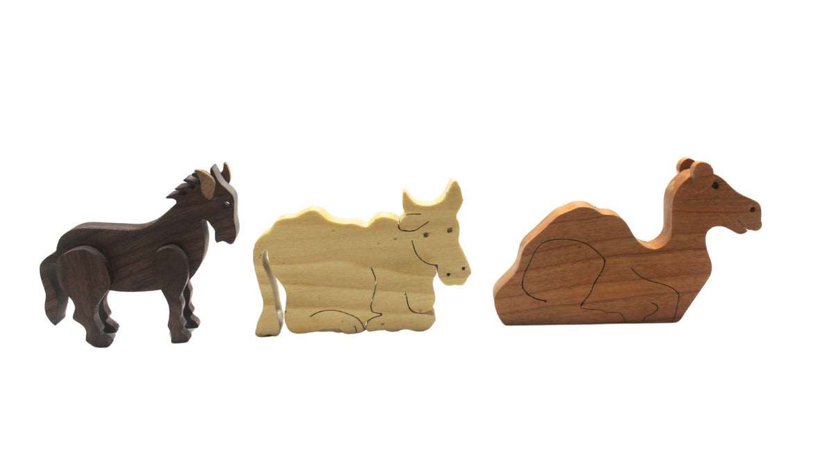 Nativity set with barn and figures. Mary, Joseph, baby Jesus in a manger. Includes angel, shepherds, three kings, sheep, camel, donkey, cow