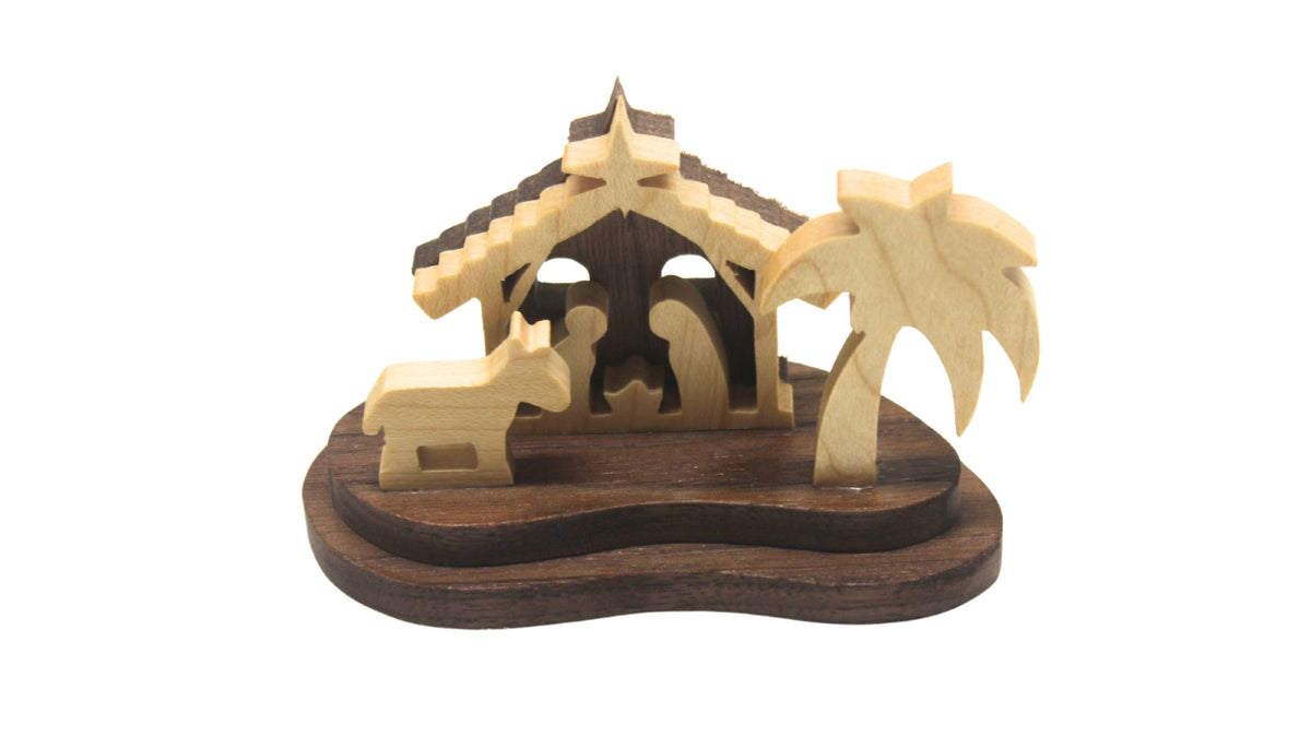 Nativity set, tiny size. Includes Mary, Joseph and the baby Jesus in a manger, donkey. Small enough to display on a desk, shelf