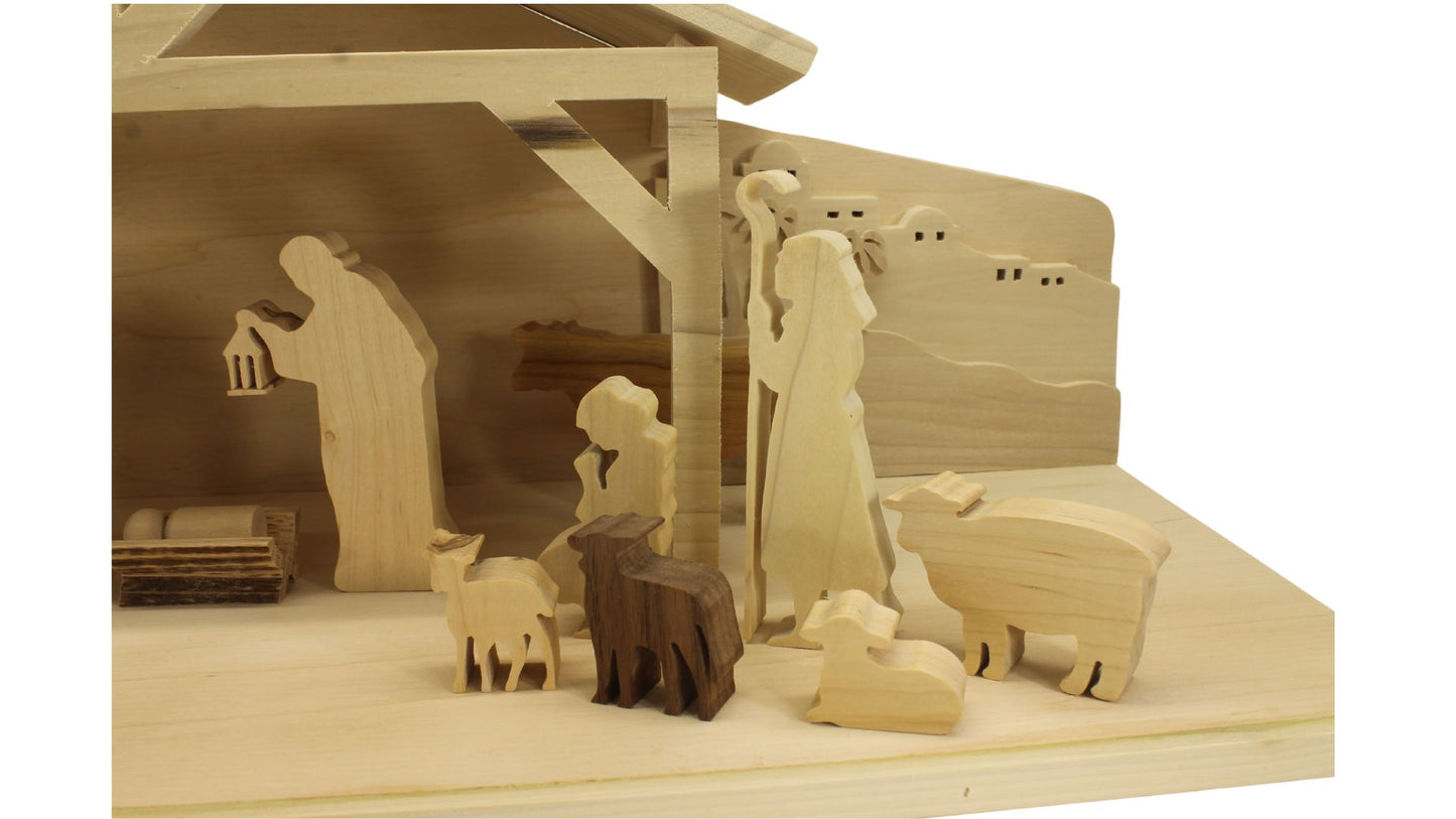 Multi-piece wood nativity with stable and figures, town of Bethlehem in the background