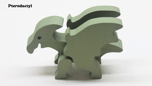 Wooden dinosaurs sold individually or as a set. Brontosaurus, triceratops, pterodactyl, tyrannosaurus rex, and stegosaurus. Choice of oak or painted green