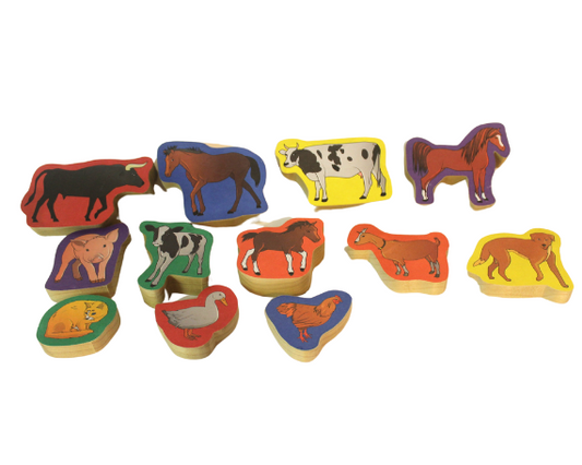 Fun way for a child to learn farm animals: a set of blocks with animal pictures on them. The 12 in the set include cows, horses, pigs, dog