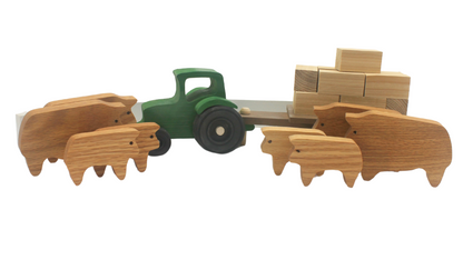 Cattle ranch play set with a tractor, wagon, cows, and hay bales