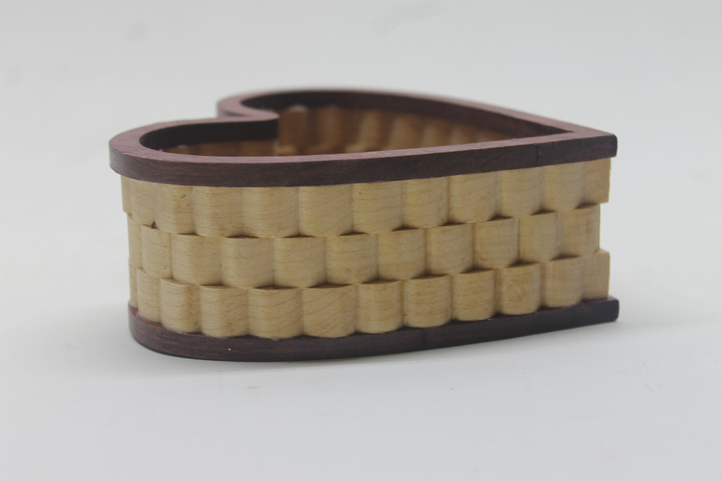 Heart-shaped handcrafted wood jewelry basket, made from purpleheart and maple