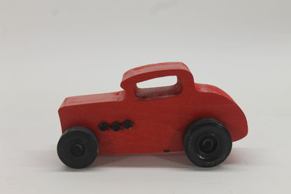 Wooden toy Ford hot rod set, 3 cars, painted yellow, red, and orange with black tires.