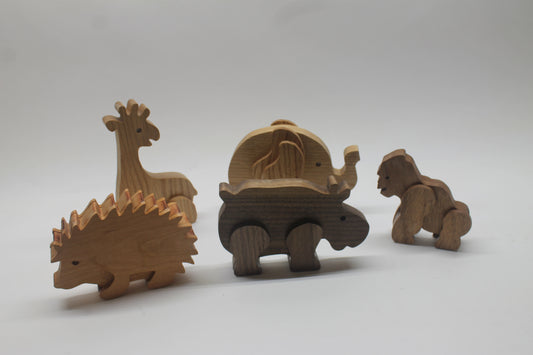 Toy wood animals sold individually or as a set: hedgehog, giraffe, elephant, hippo, gorilla