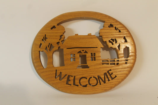 Oval welcome sign, hand cut from solid oak. This makes a great entry door or hall wall hanging