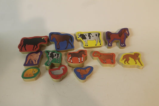 Fun way for a child to learn farm animals: a set of blocks with animal pictures on them. The 12 in the set include cows, horses, pigs, dog