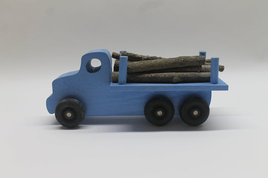 Logging truck, solid poplar, branches to simulate cut trees included