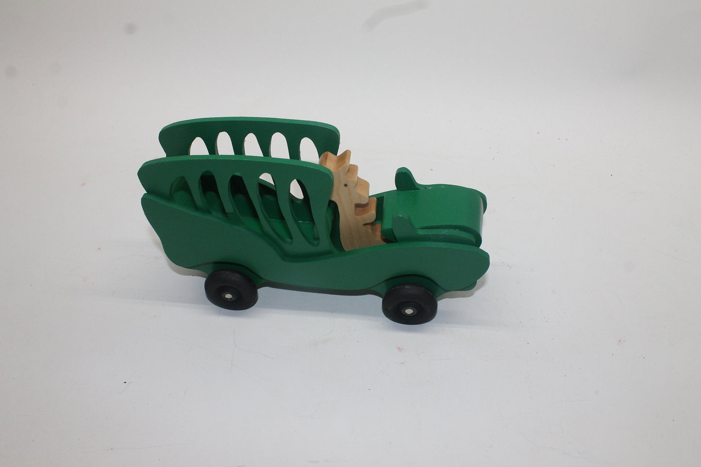 Serengeti safari play set. It contains a vehicle, people, animals, cage, and even a tree. Solid wood construction