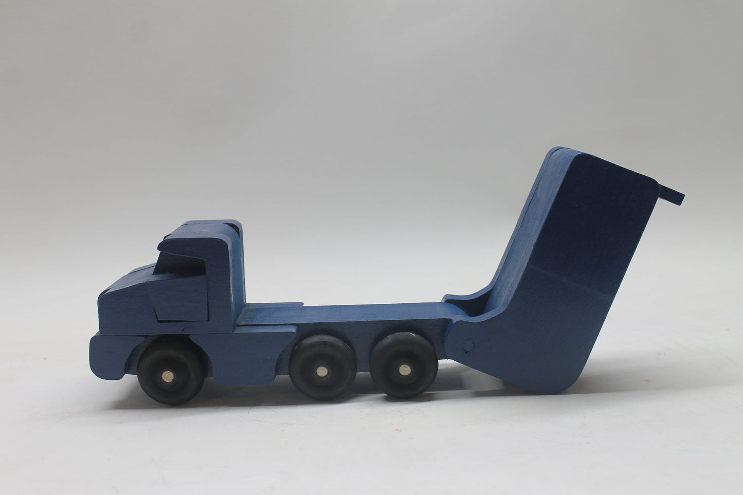 Toy wooden dump truck. What toy truck is more fun for kids than a dump truck? This tilting bed truck comes in oak or a choice of colors