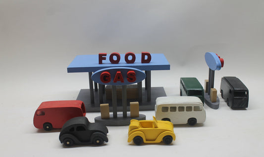 Toy wood gas and food stop with VW vehicles, gas islands, fast food restaurant