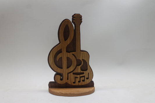 Guitar music display. Choice of stand or wall hanging. Cut by hand from oak and sapele